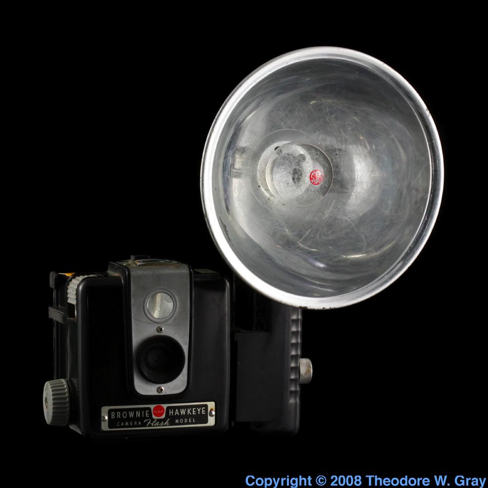 Brownie camera with flash bulb, a sample of the element Zirconium in